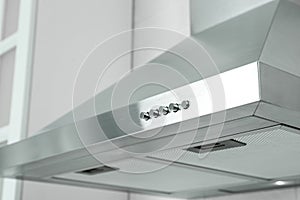 Modern range hood in kitchen, closeup view