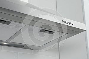 Modern range hood in kitchen, closeup view