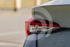 Modern rear light of a car. Brake light and arrow of large suv.