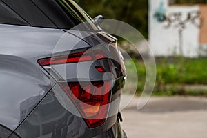 Modern rear light of a car. Brake light and arrow of large suv.