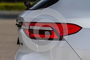 Modern rear light of a car. Brake light and arrow of large suv.