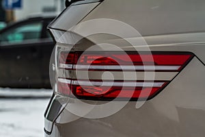 Modern rear light of a car. Brake light and arrow of large suv.