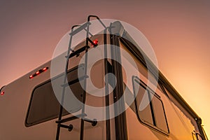 Modern Recreational Vehicle in the Sunset Lights