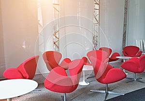Modern red chairs in the meeting room for listening sessions