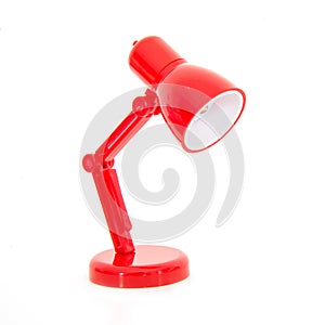 Modern red color desk lamp on white background