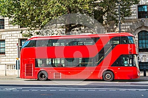 Modern red double decker bus, London