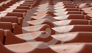 Modern red roof tiles in a seamless wave pattern