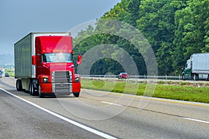 Modern Red Semi Truck On The Interstate