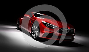 Modern red sports car in a spotlight on a black background.