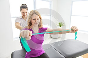 Modern rehabilitation physiotherapy at work with client