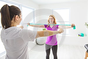 Modern rehabilitation physiotherapy at work with client