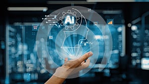 Abstract representation of artificial intelligence concept with human hand holding holographic brain gear, digital data