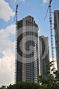 Modern residence construction and tower cranes