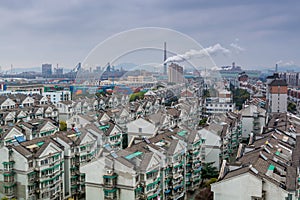 Modern residential area with background of smoke pollution in Ningbo City, Zhejiang, China