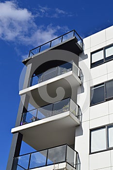 A modern residential block against a blue sky