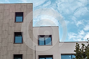 Modern residential building facade architecture with blue sky