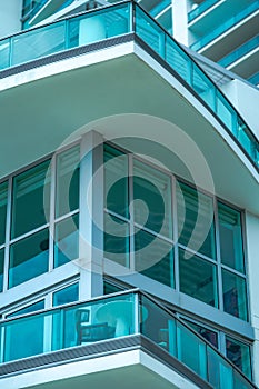 Modern residential glass-walled building, vertical shot photo