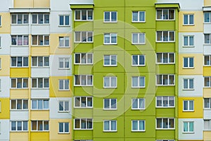 Modern residential multi-storey building. Windows and balconies on a new residential building close-up. Buying and selling