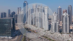 Modern residential and office complex with many towers aerial view at Business Bay, Dubai, UAE.