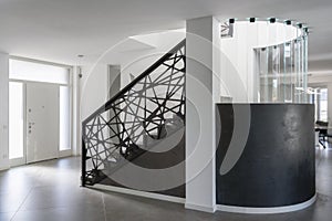 Modern resin staircase inside luxury house, glass and iron elements complete the design