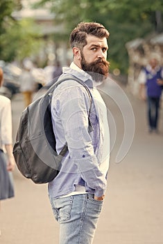 Modern rest. Bearded man travel. Guy exploring city. Discover local showplace. Backpack for urban traveling. Hipster photo