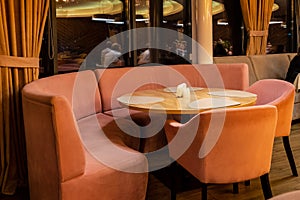 Modern restaurant interior in evening. Cozy and comfortable dining place