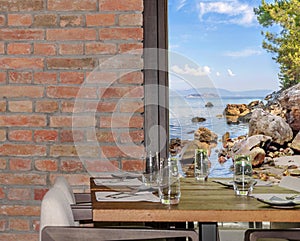 Modern restaurant interior with scenic seaside view