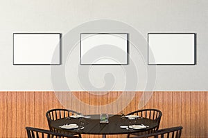 Modern restaurant interior with served tables and blank poster