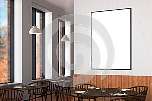 Modern restaurant interior with served tables and blank poster