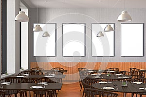 Modern restaurant interior with served tables and blank poster