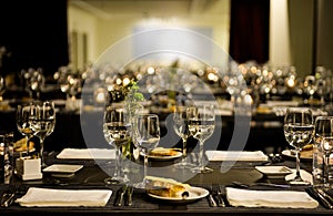 Modern Restaurant - Lighted Candles, White Napkins, Corn Bread, Elegant Table Set