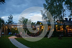 Modern restaurant with terrace in evening illumination