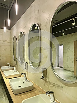 Modern restroom interior with stone gray tiles. interior of public toilet.