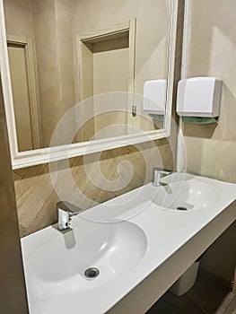 Modern restroom interior with stone gray tiles. interior of public toilet.