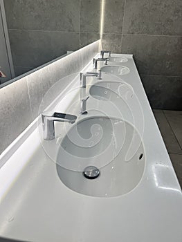 Modern restroom interior with stone gray tiles. interior of public toilet.