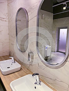 Modern restroom interior with stone gray tiles. interior of public toilet.