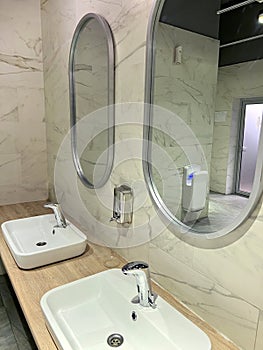 Modern restroom interior with stone gray tiles. interior of public toilet.