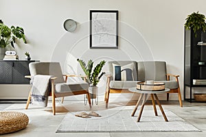 Modern retro concept of home interior with design sofa, armchair, coffee table, plants, mock up poster map, carpet.