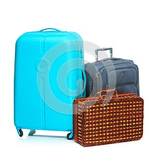 The modern and retro suitcases on white background