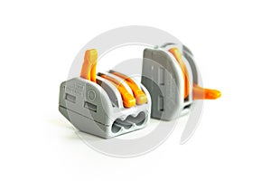 Modern reusable electrical terminals on white background