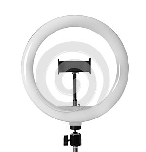 Modern ring light on stand against white