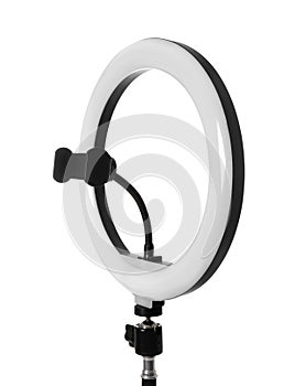 Modern ring light on stand against white background