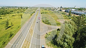 Modern road with autos near large truck service station aerial