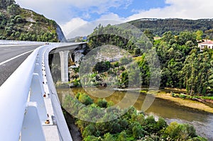 Modern road bridge over river Brazo Mayor in San Vicente de la B photo