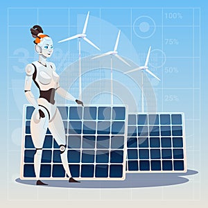 Modern Robot Female Over Wind Turbine And Solar Panels Renewable Energy Artificial Intelligence Technology Concept