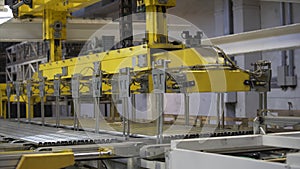 Modern robotic Aluminium extrusion production line factory warehouse. Plastic windows manufacture. photo