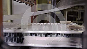 Modern robotic packaging line of heating radiators in factory