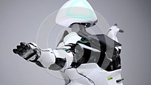 Modern Robotic Technologies. White modern robot in a bright studio. Android dancing, waving his arms. Demonstration of a