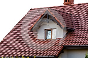 Modern roof with stylish small brown window