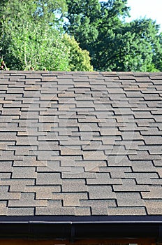 Modern roofing and decoration of chimneys. Flexible bitumen or slate shingles